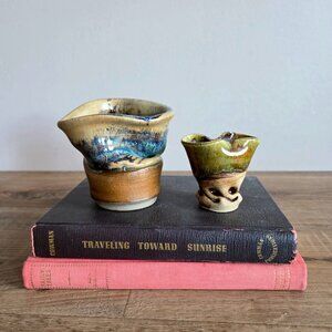 2 small handcrafted ceramic vases with unique ruffled rim. Signed by artists.